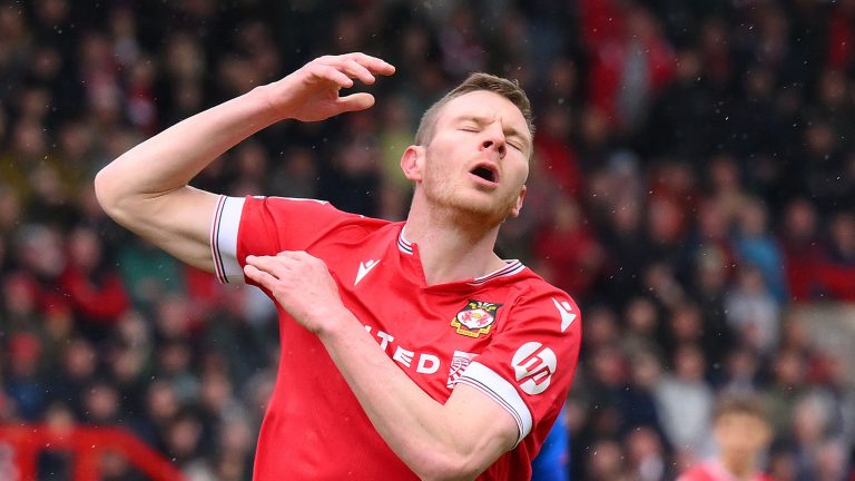 Paul Mullin sparks fresh Wrexham injury fears as he's spotted grimacing in pain after early substitution in EFL Trophy win over Salford