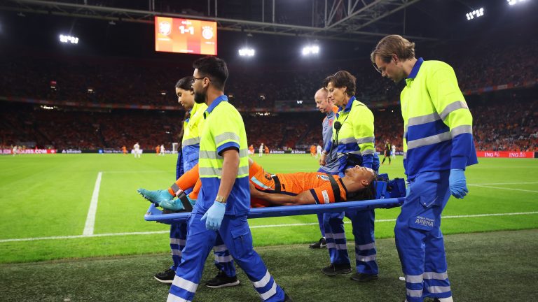 Massive Man City blow as Nathan Ake can't hold back emotion after being stretchered off during Netherlands clash with Germany